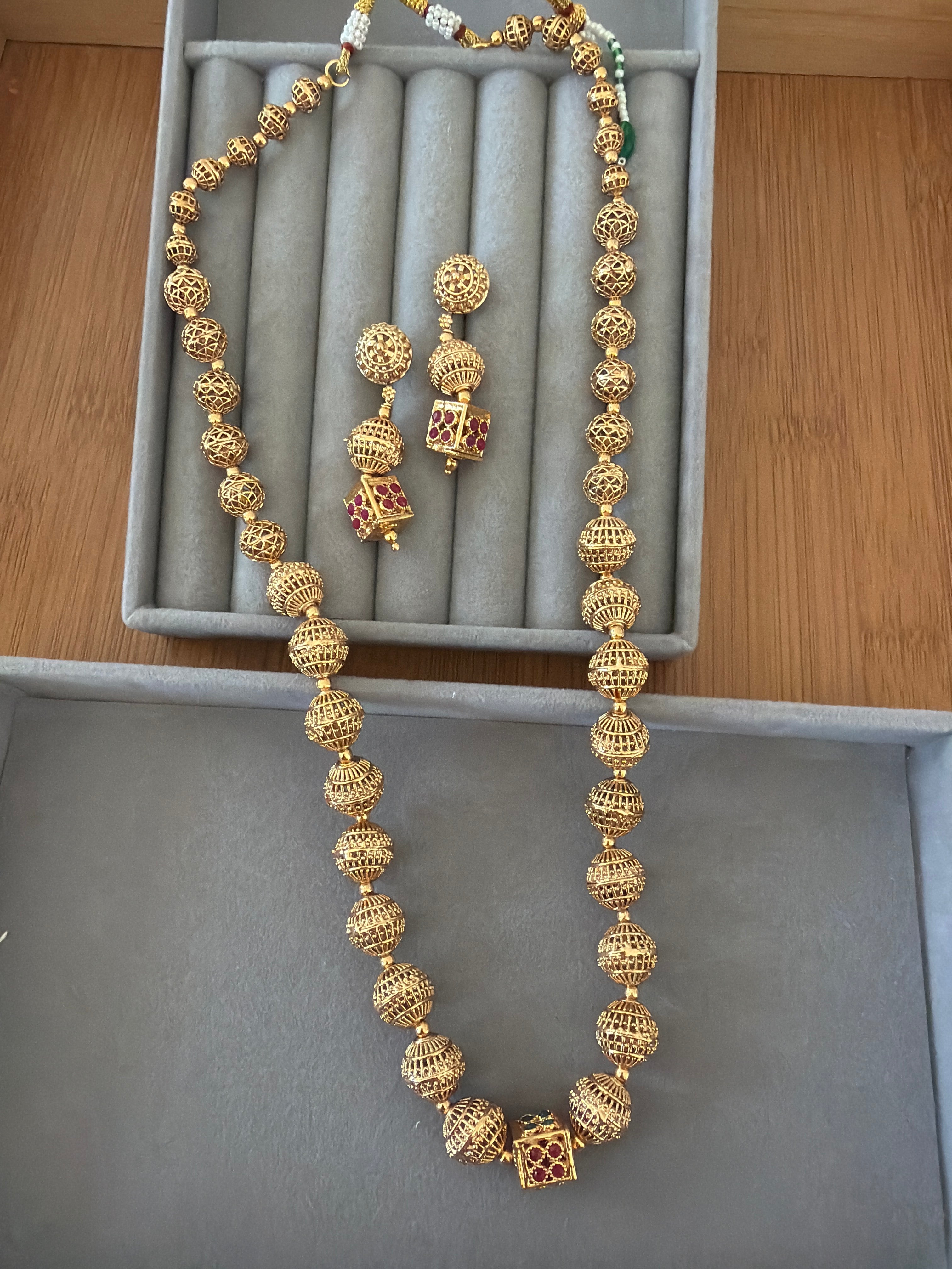 Gold bead long necklace